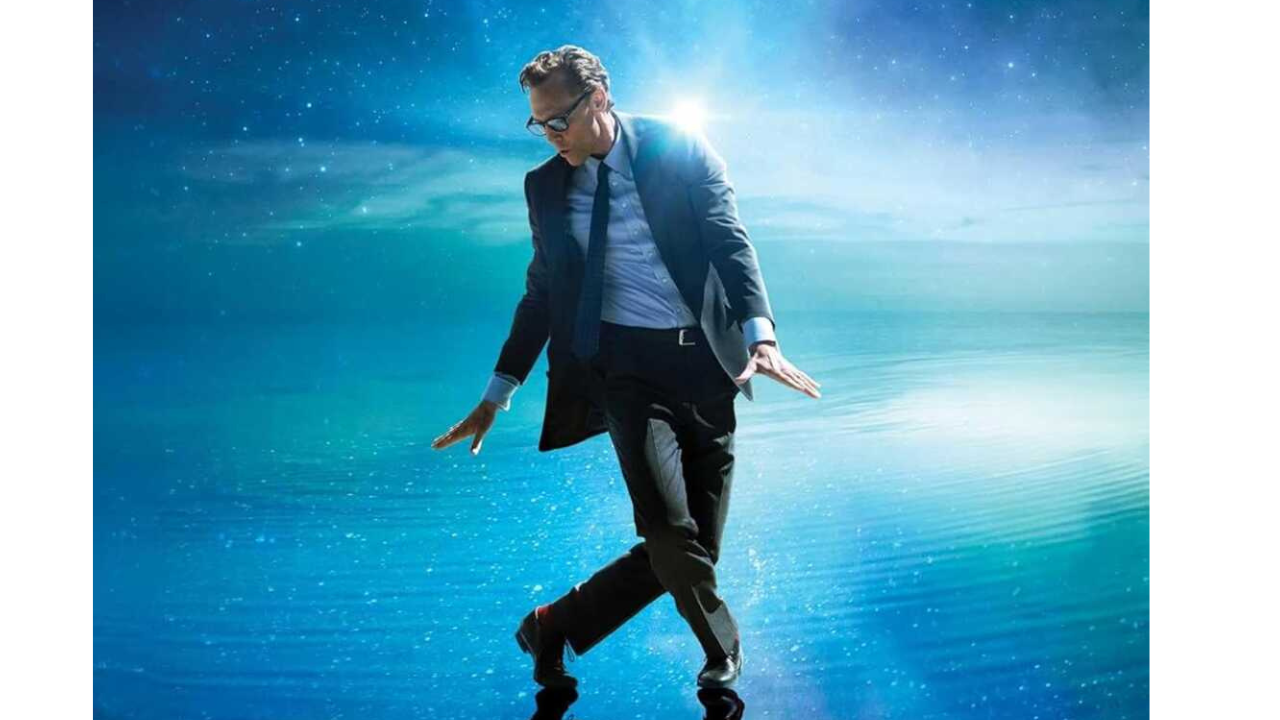 Tom Hiddleston dancing against a starry blue background.